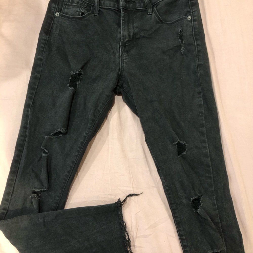 Black mid-rise ripped skinny jeans